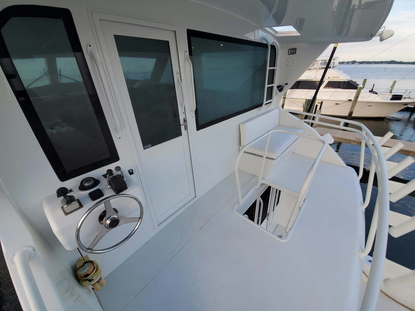 a white machine with a window aboard No Name Yacht for Sale