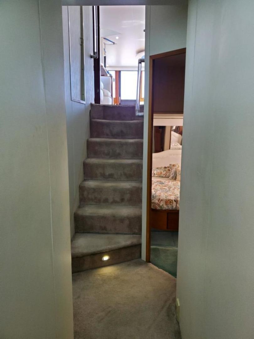 a staircase with a bed aboard No Name Yacht for Sale