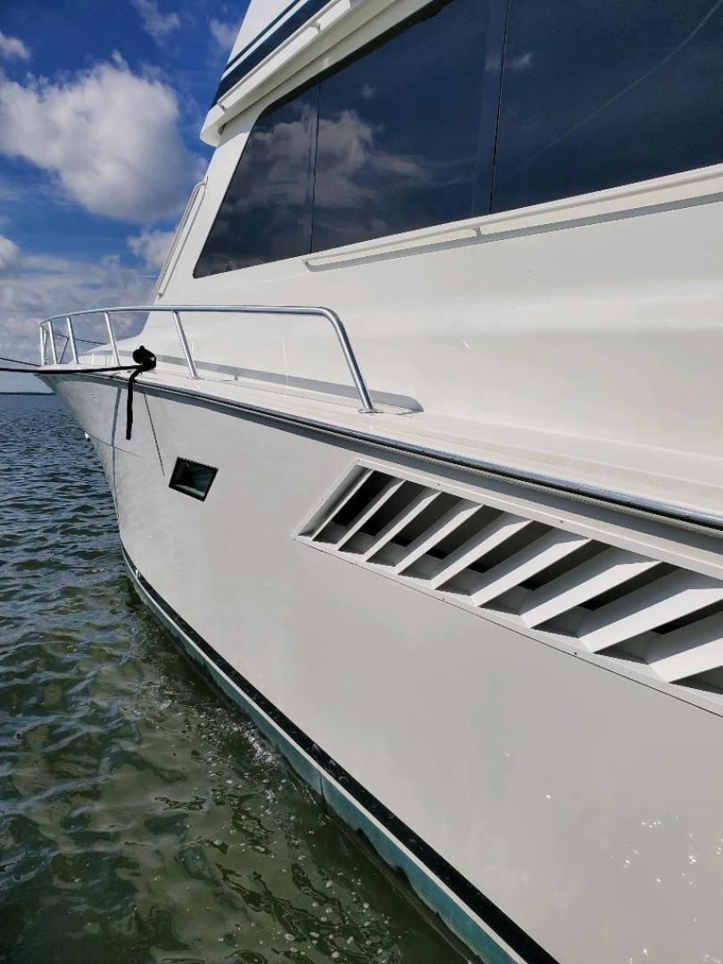a white boat in the water aboard No Name Yacht for Sale