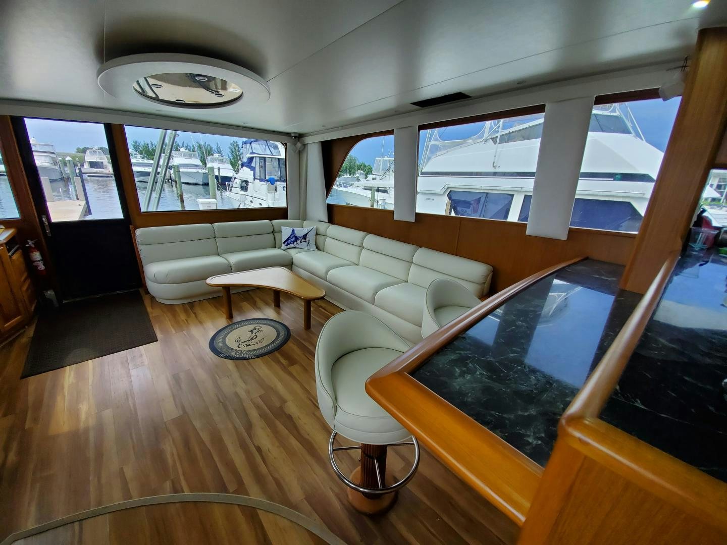 a living room with a large window aboard No Name Yacht for Sale
