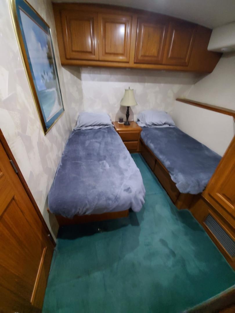 a couple of beds in a room aboard No Name Yacht for Sale