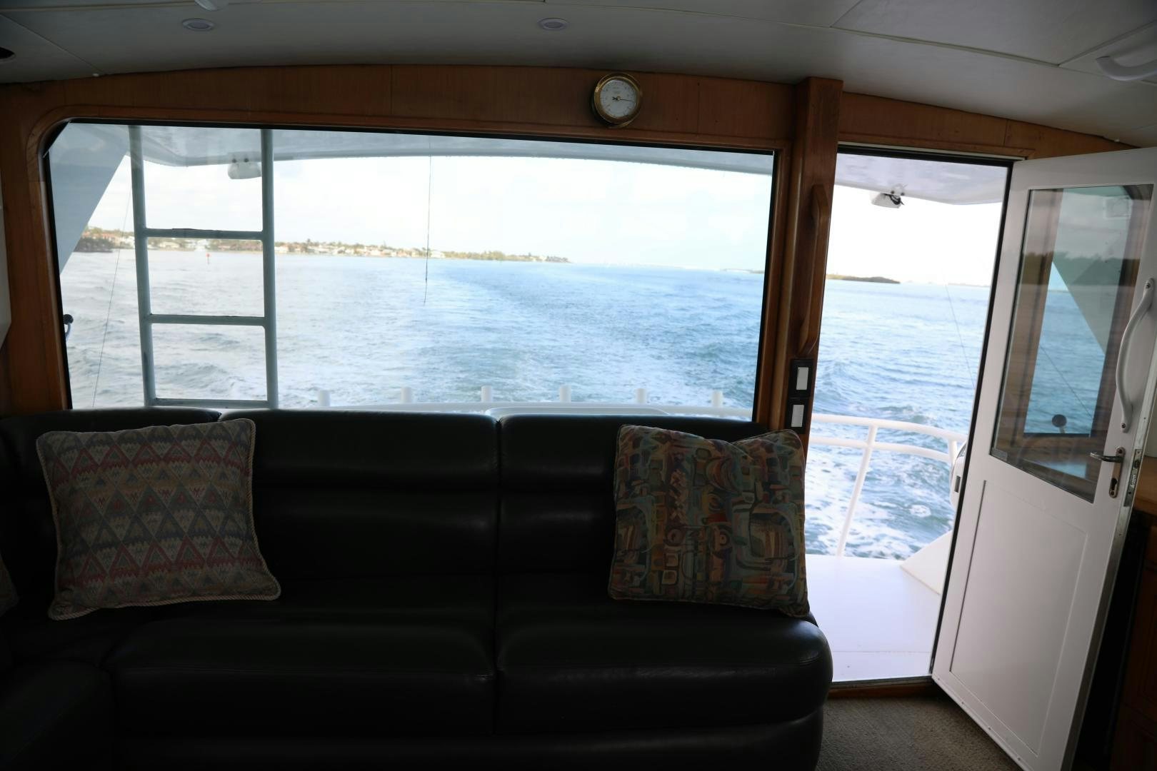 a couch in a room aboard No Name Yacht for Sale