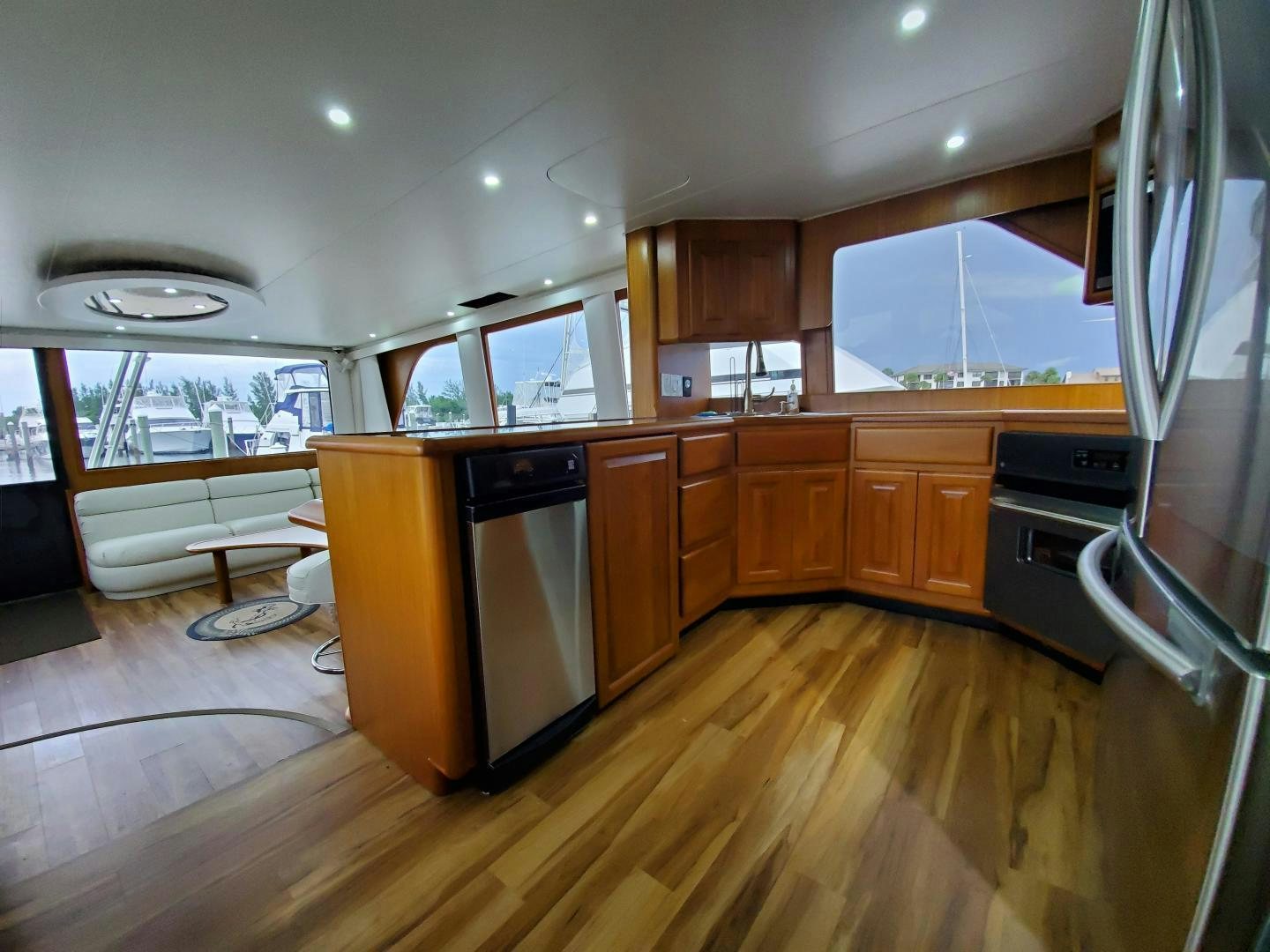 a kitchen with wooden cabinets aboard No Name Yacht for Sale