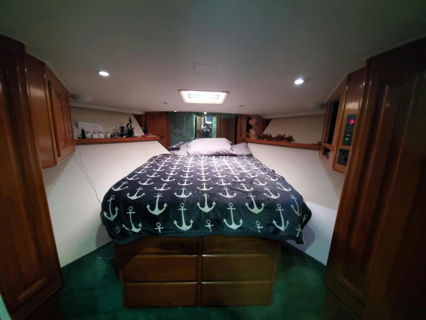a person taking a selfie in a bedroom aboard No Name Yacht for Sale