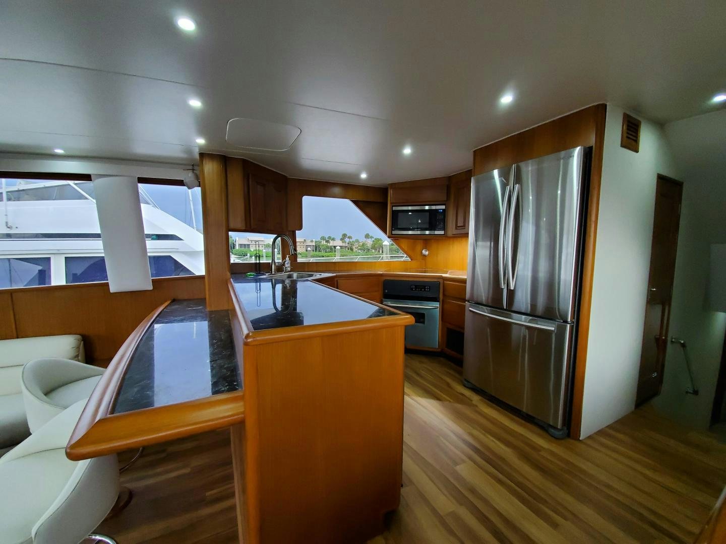 a kitchen with a large refrigerator aboard No Name Yacht for Sale