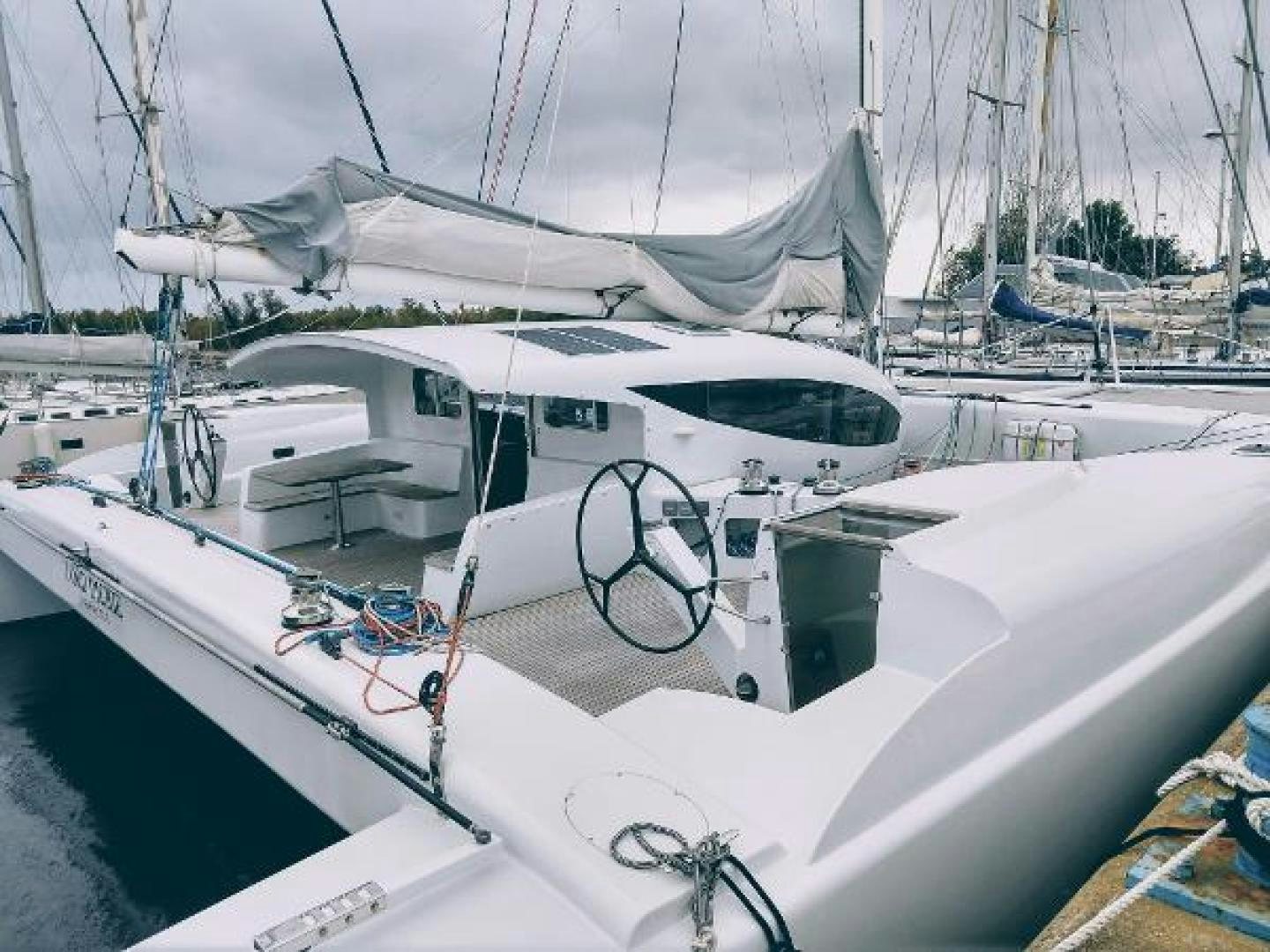 a boat with a white roof aboard No Name Yacht for Sale