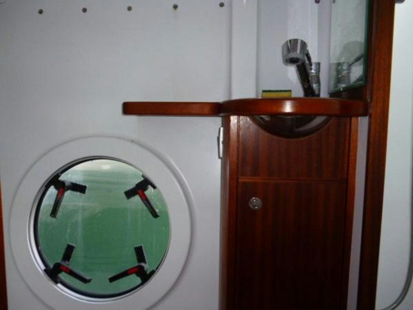 a shower with a round mirror aboard No Name Yacht for Sale