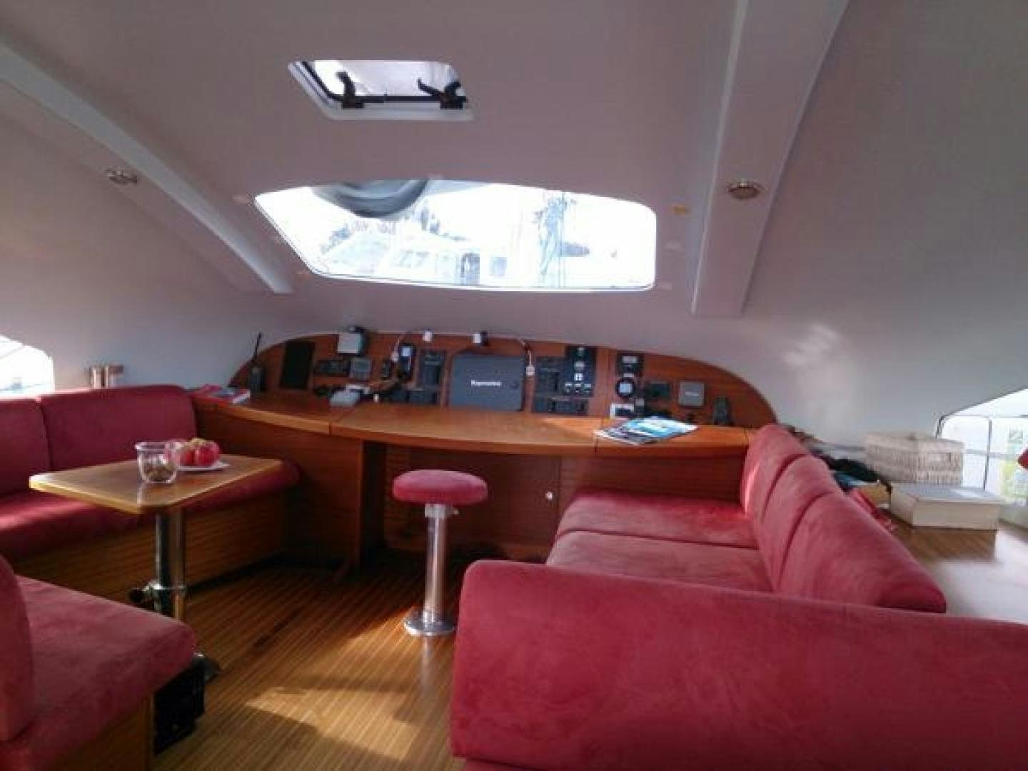 a living room with a large screen aboard No Name Yacht for Sale