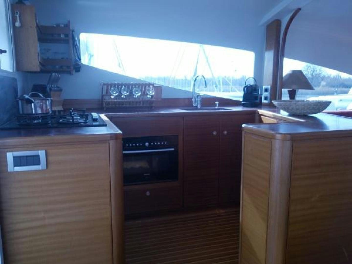 a kitchen with a stove and oven aboard No Name Yacht for Sale