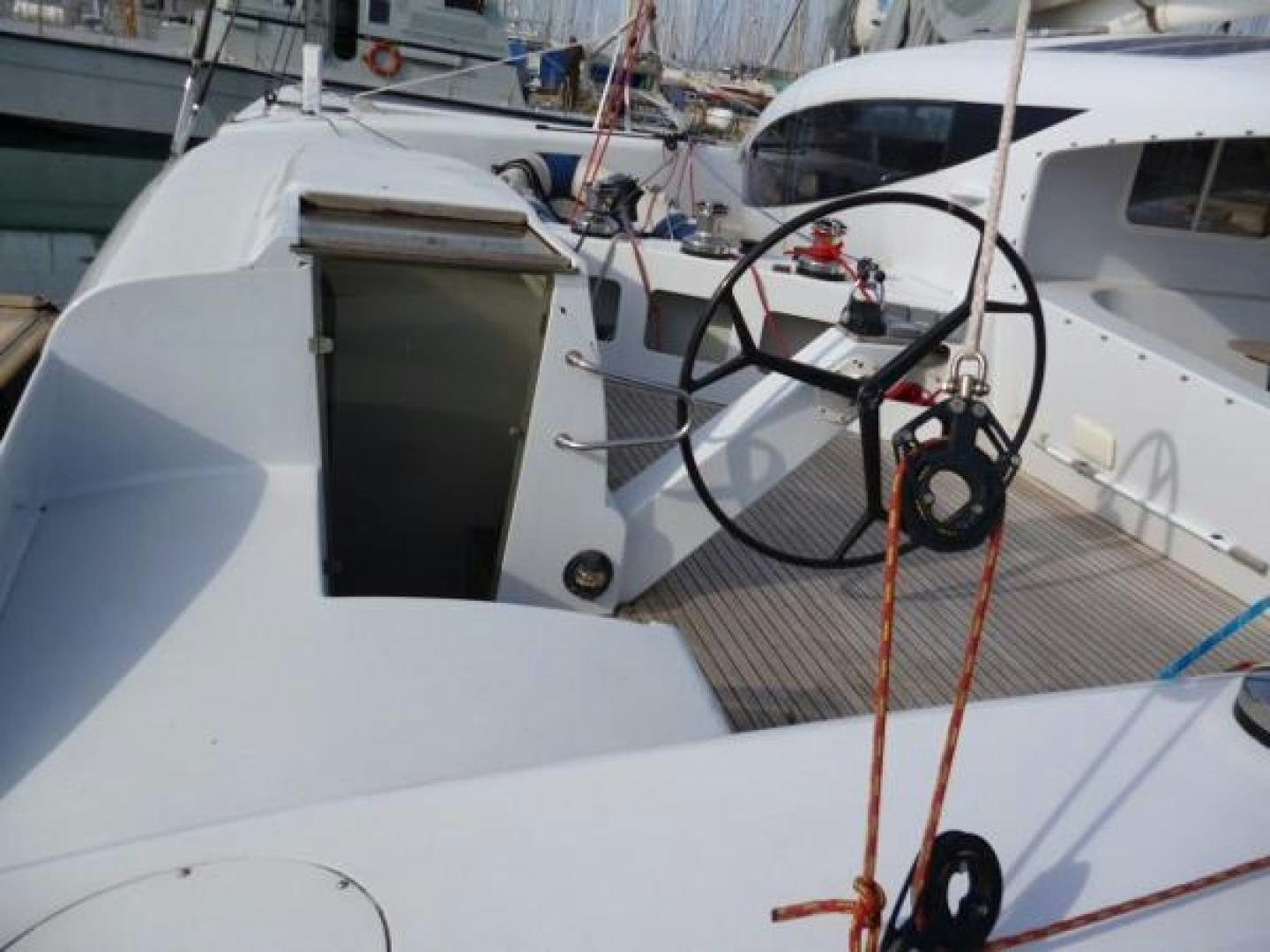 a white boat with a red rope attached to it aboard No Name Yacht for Sale