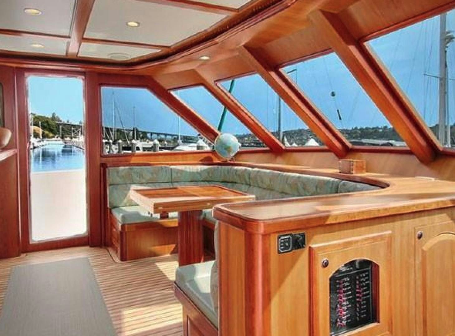 a room with a large window and a pool table aboard No Name Yacht for Sale