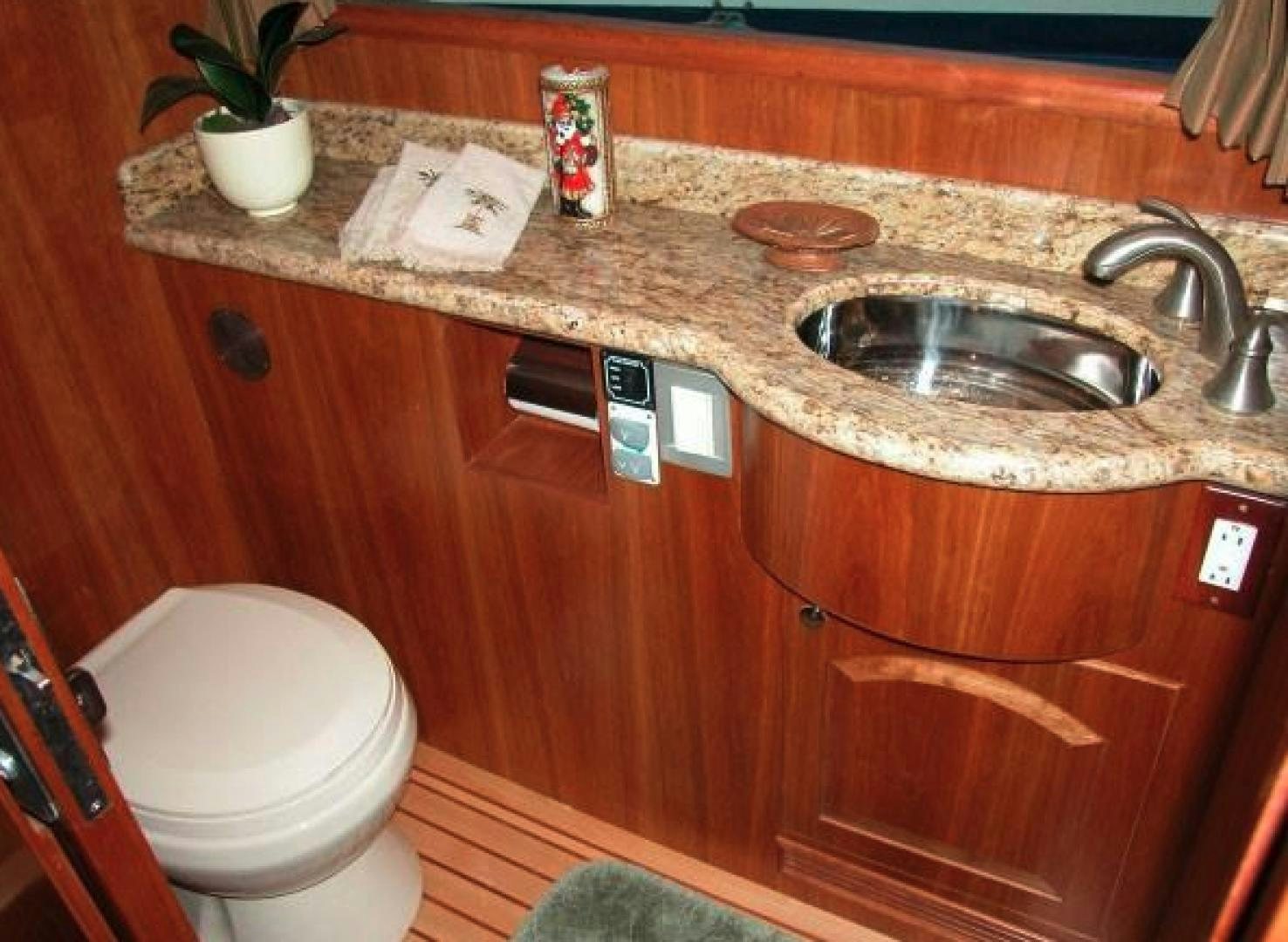 a bathroom with a sink and toilet aboard No Name Yacht for Sale