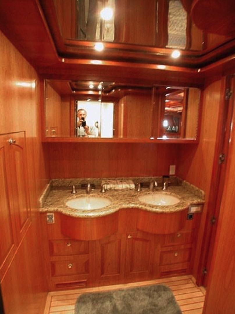 a bathroom with a large mirror aboard No Name Yacht for Sale