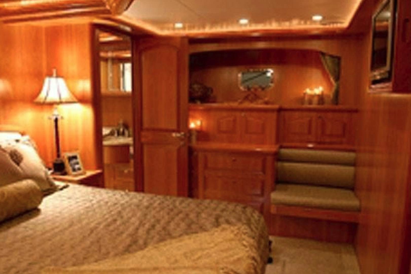 a room with a bed and a couch aboard No Name Yacht for Sale