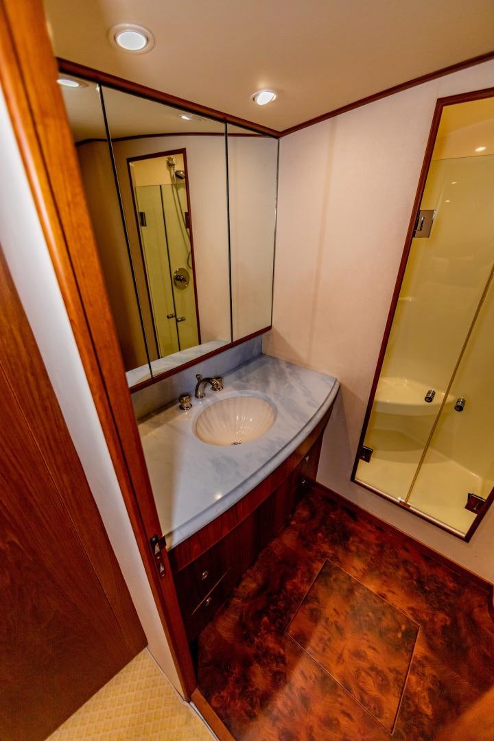 a bathroom with a sink and a mirror aboard WATASHEE Yacht for Sale