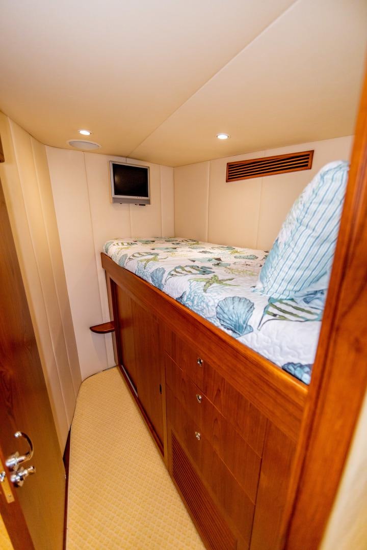 a bedroom with a bed aboard WATASHEE Yacht for Sale