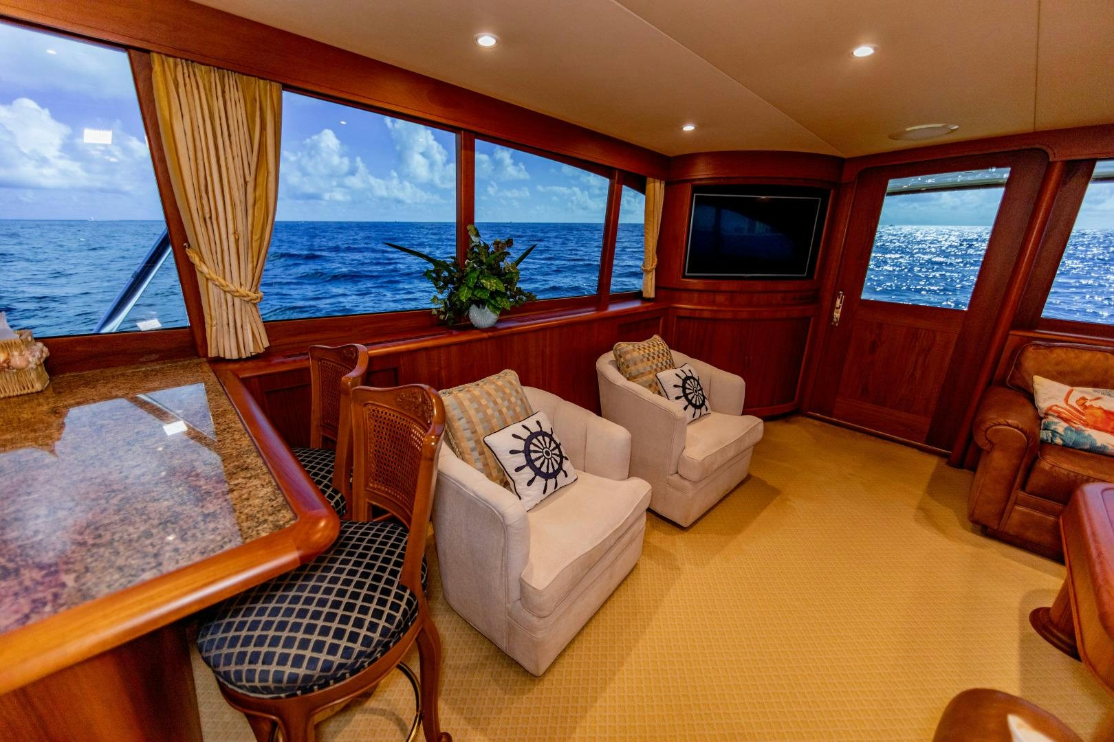 a living room with a large window aboard WATASHEE Yacht for Sale