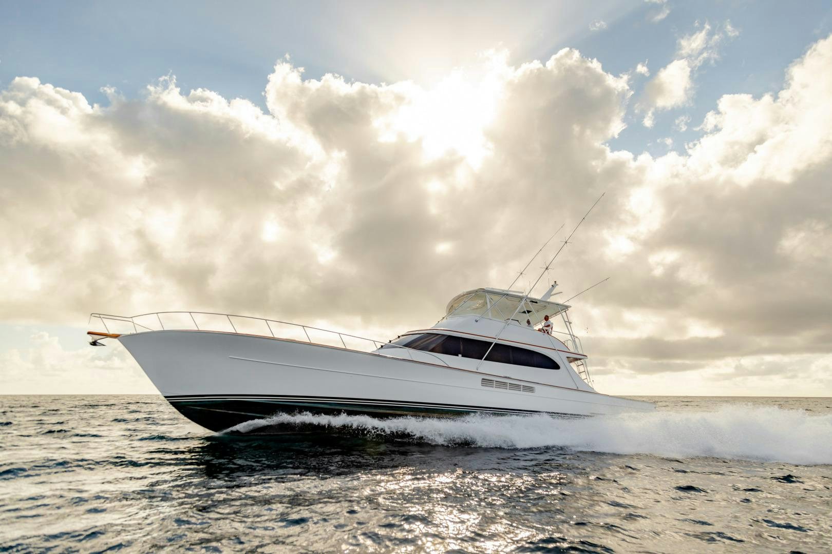 a white yacht on the water aboard WATASHEE Yacht for Sale