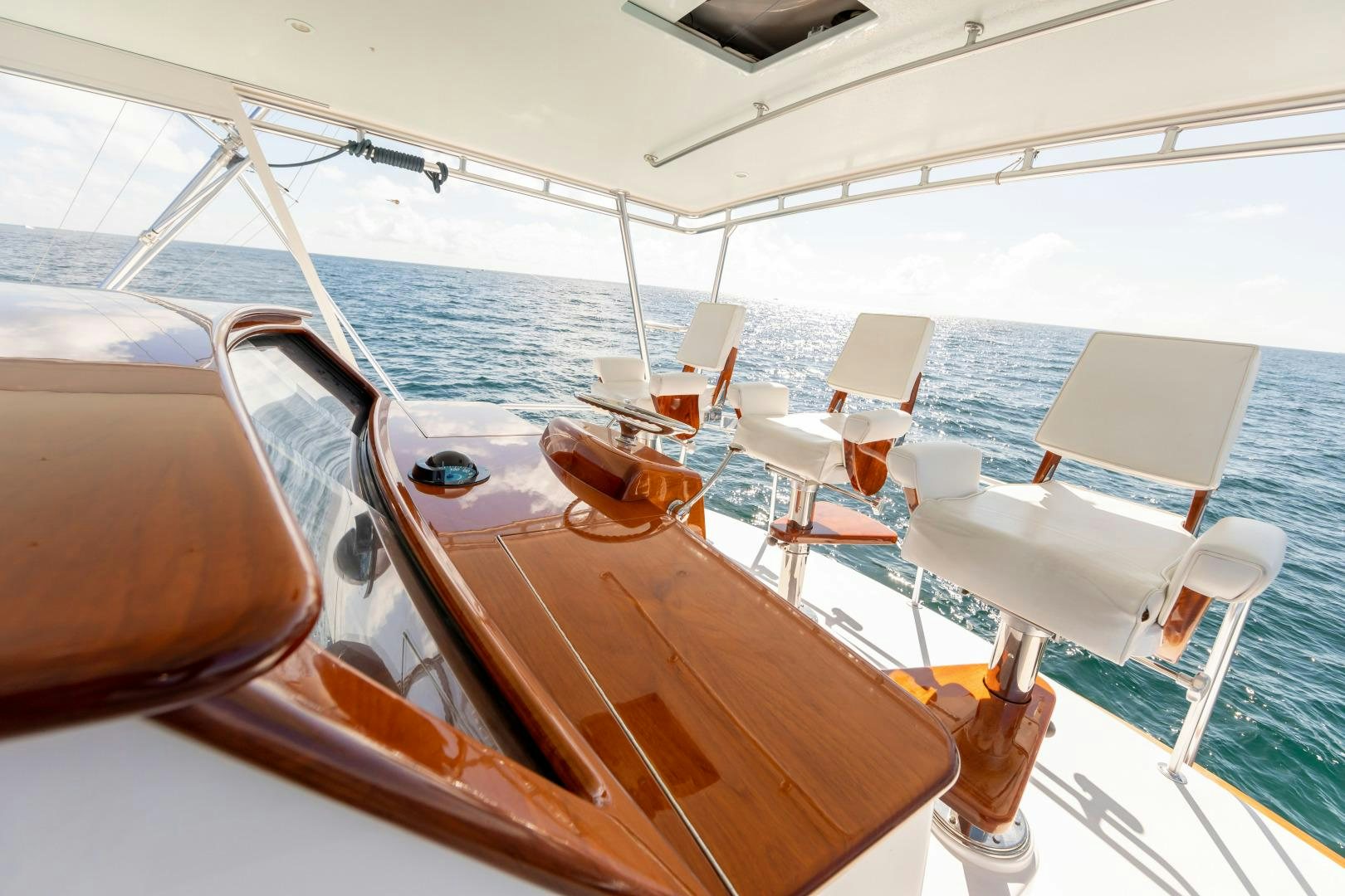 a boat with a table and chairs aboard WATASHEE Yacht for Sale
