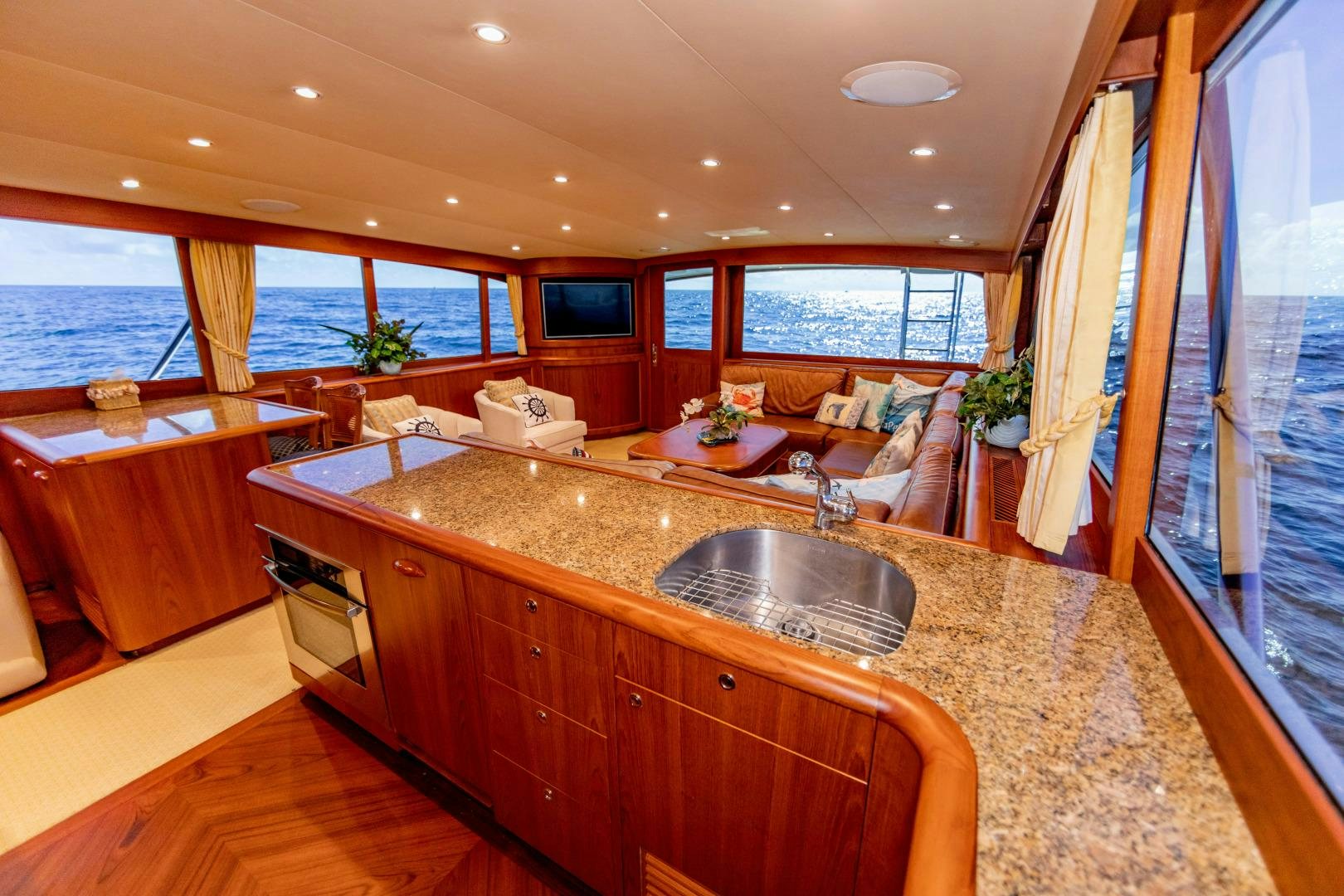 a kitchen with a large island aboard WATASHEE Yacht for Sale