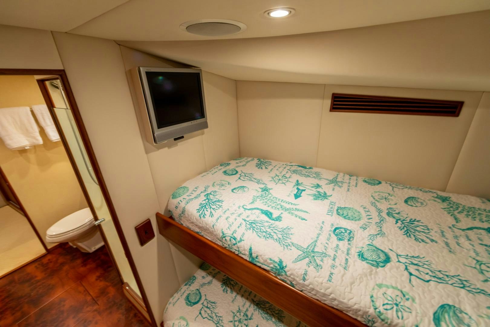 a bed with a television on top of it aboard WATASHEE Yacht for Sale