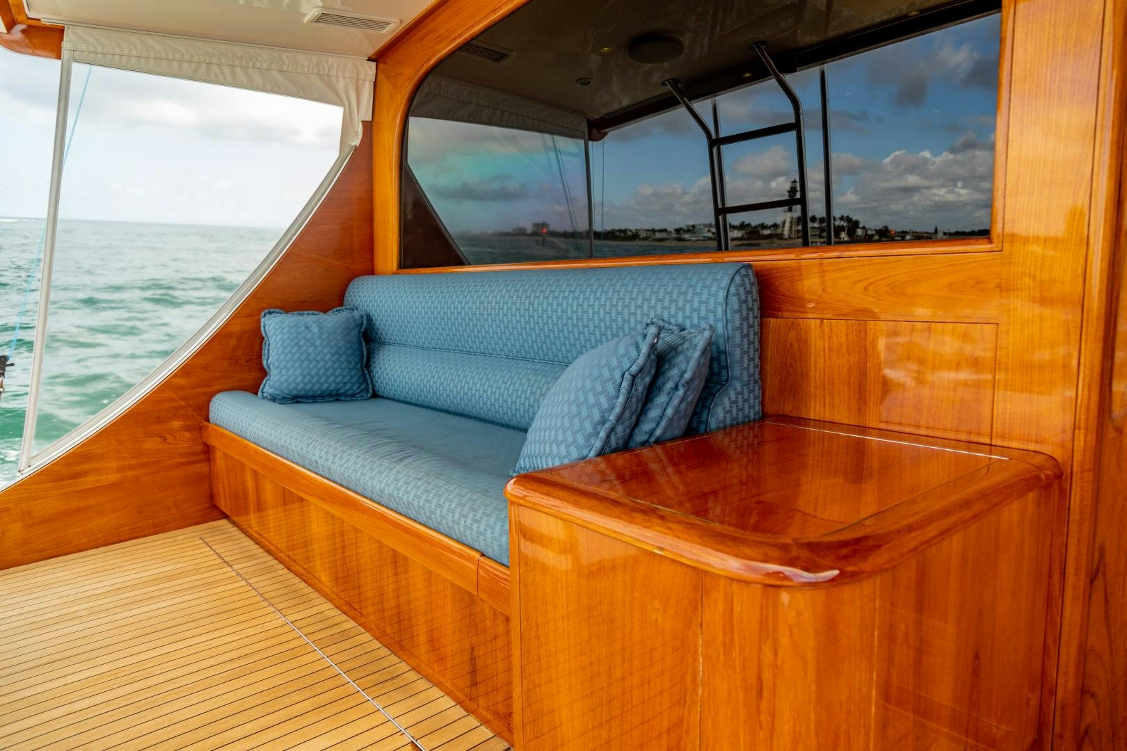 a boat with pillows on a wooden boat aboard WATASHEE Yacht for Sale