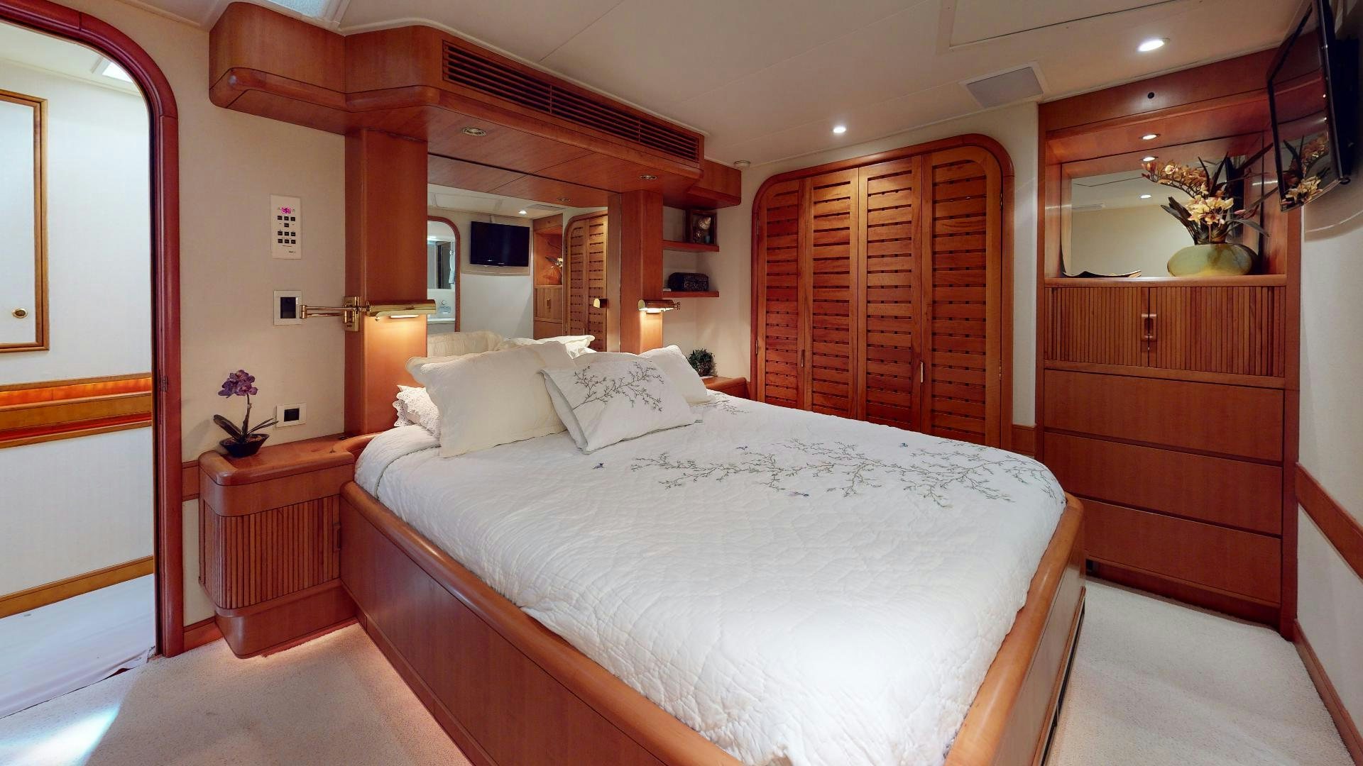a large bed in a room aboard clean sweep Yacht for Sale