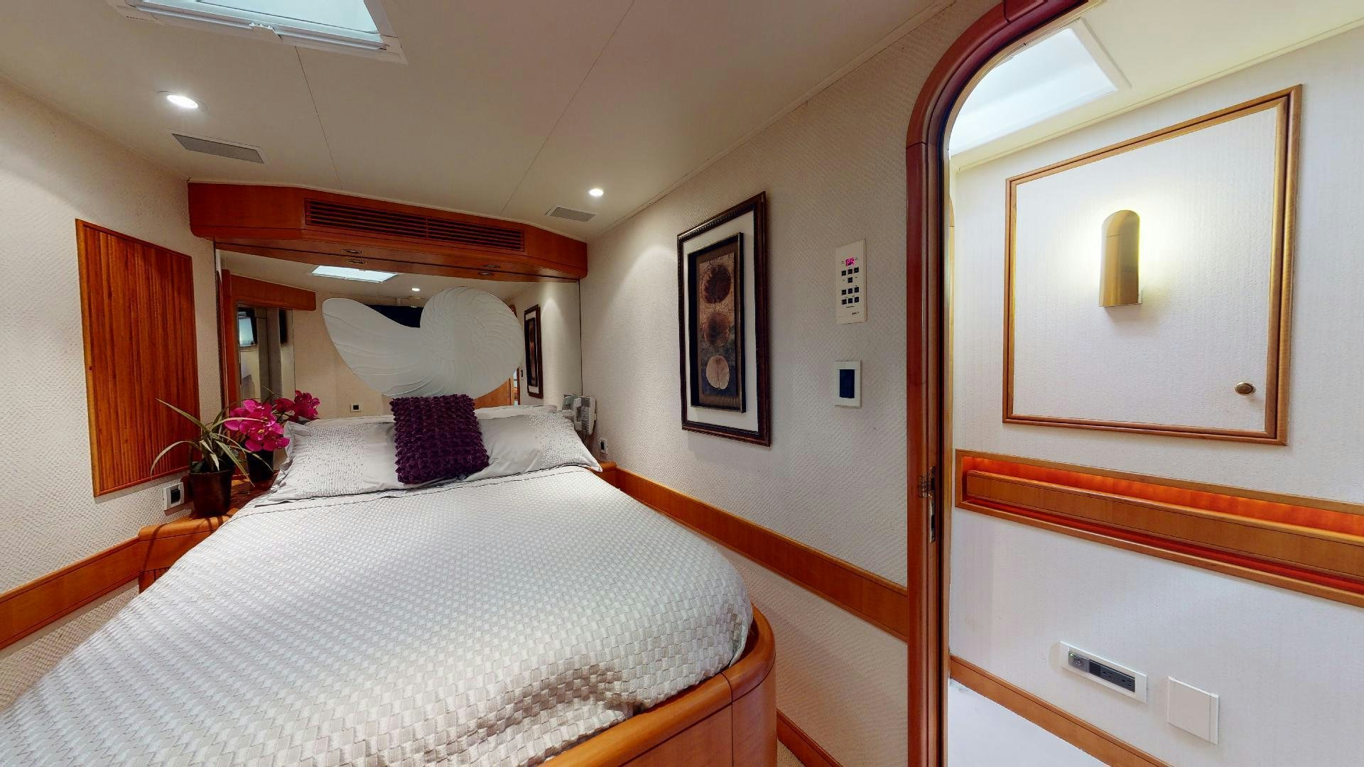 a bed in a room aboard clean sweep Yacht for Sale