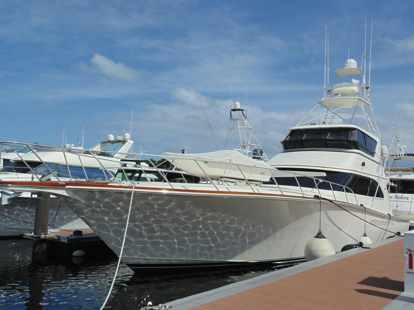 a couple of large white yachts aboard clean sweep Yacht for Sale
