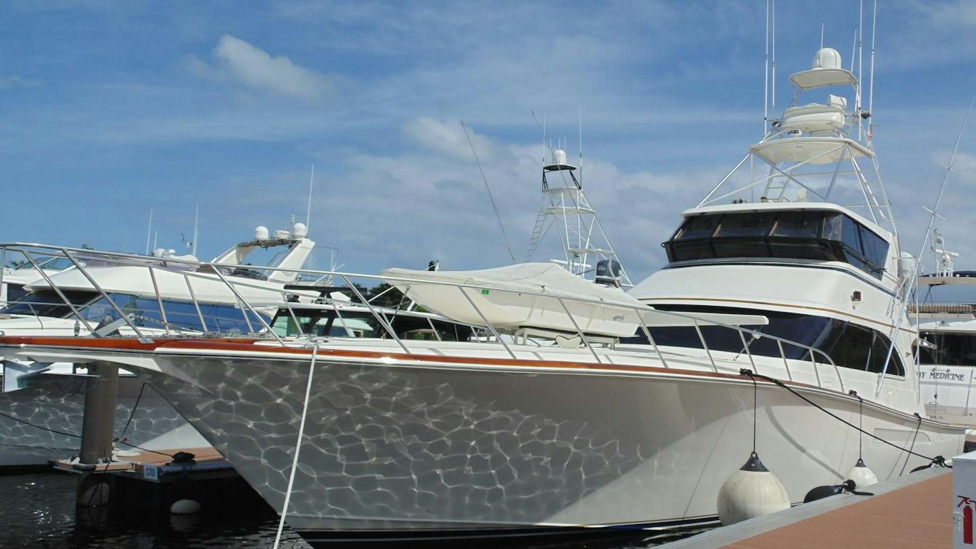 a couple of large white yachts aboard clean sweep Yacht for Sale