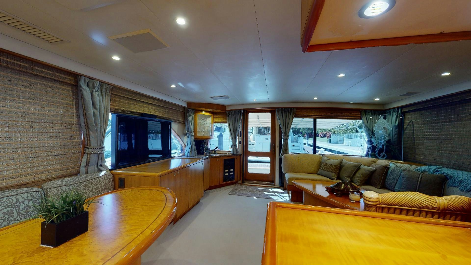 a living room with a large window aboard clean sweep Yacht for Sale