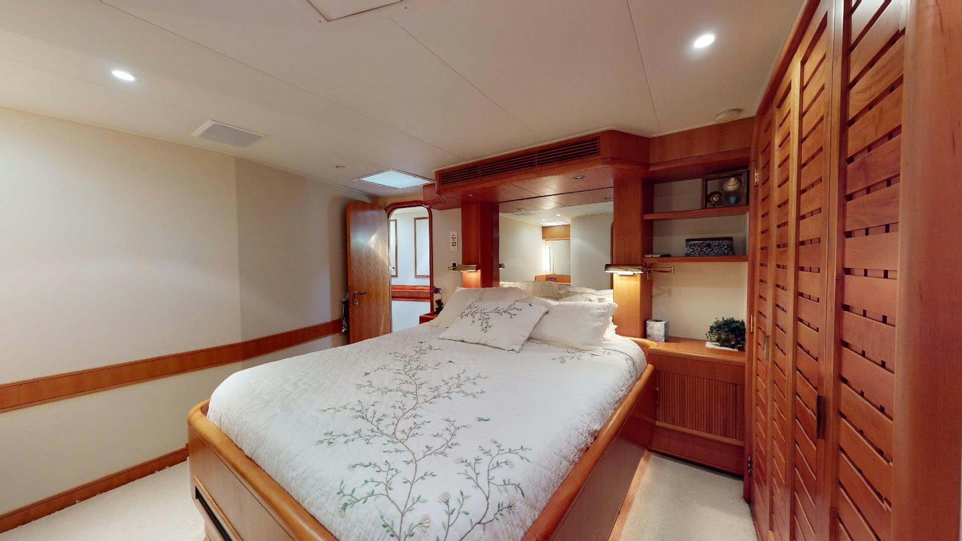 a bedroom with a large bed aboard clean sweep Yacht for Sale