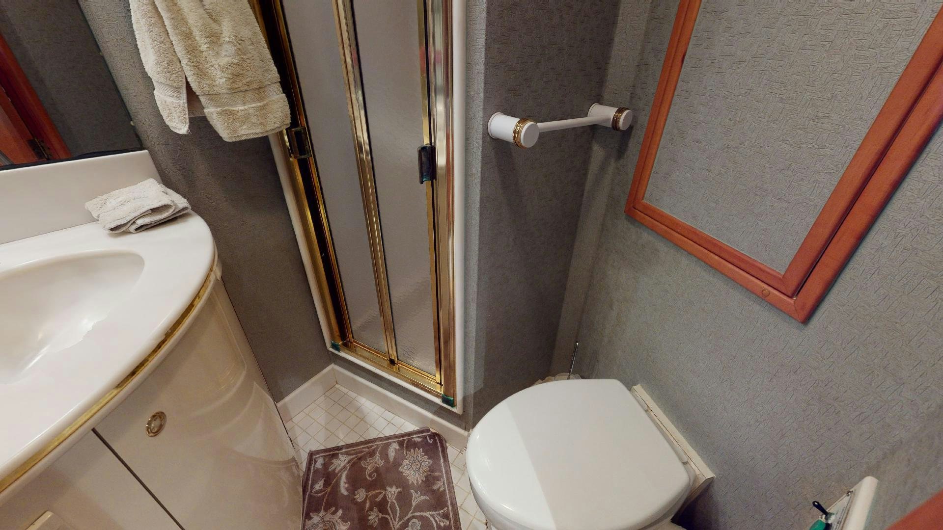a bathroom with a toilet and a sink aboard clean sweep Yacht for Sale