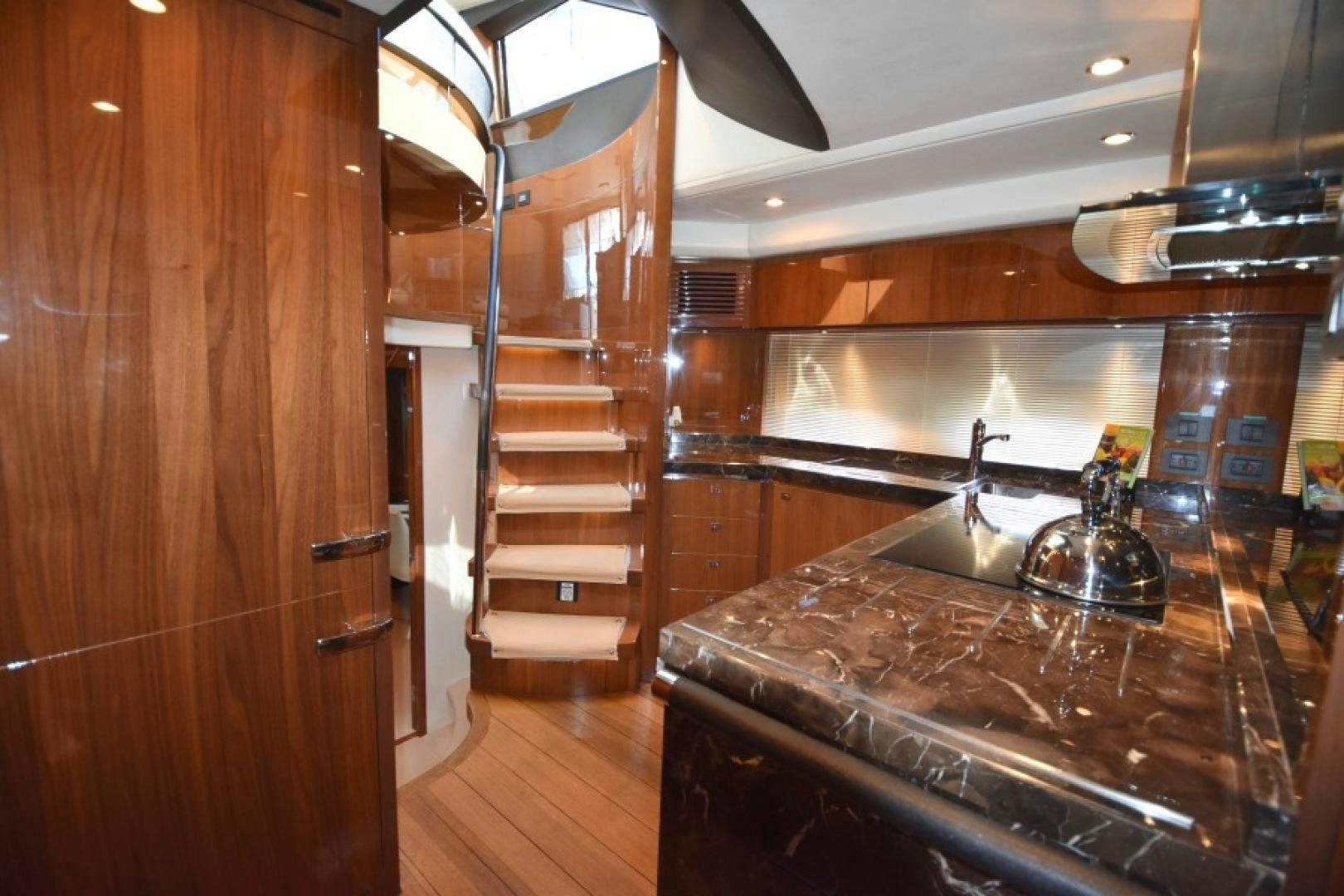 a kitchen with a marble counter top aboard No Name Yacht for Sale