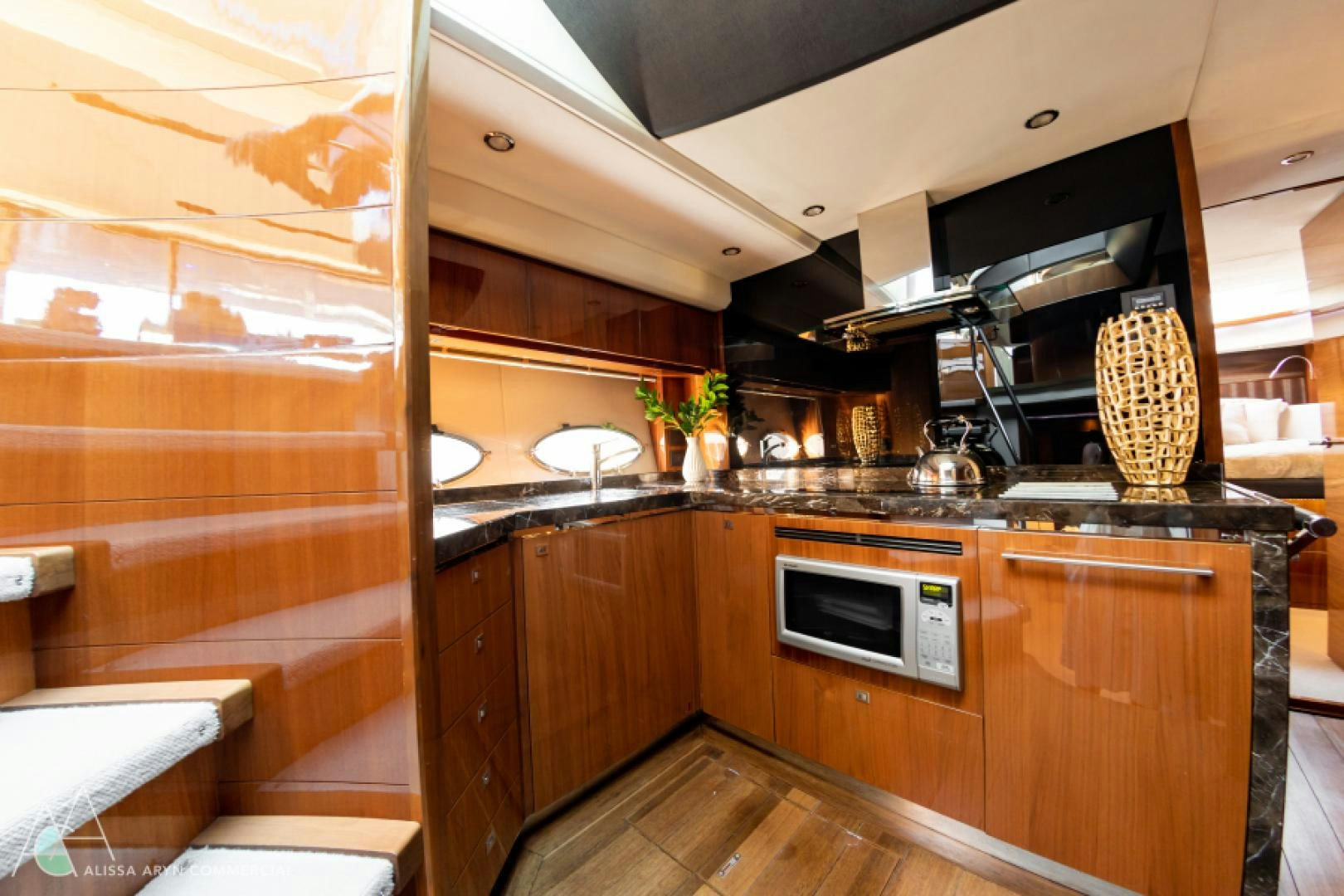 a kitchen with wooden cabinets aboard No Name Yacht for Sale