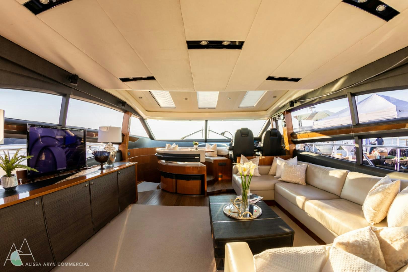 a living room with a large screen aboard No Name Yacht for Sale