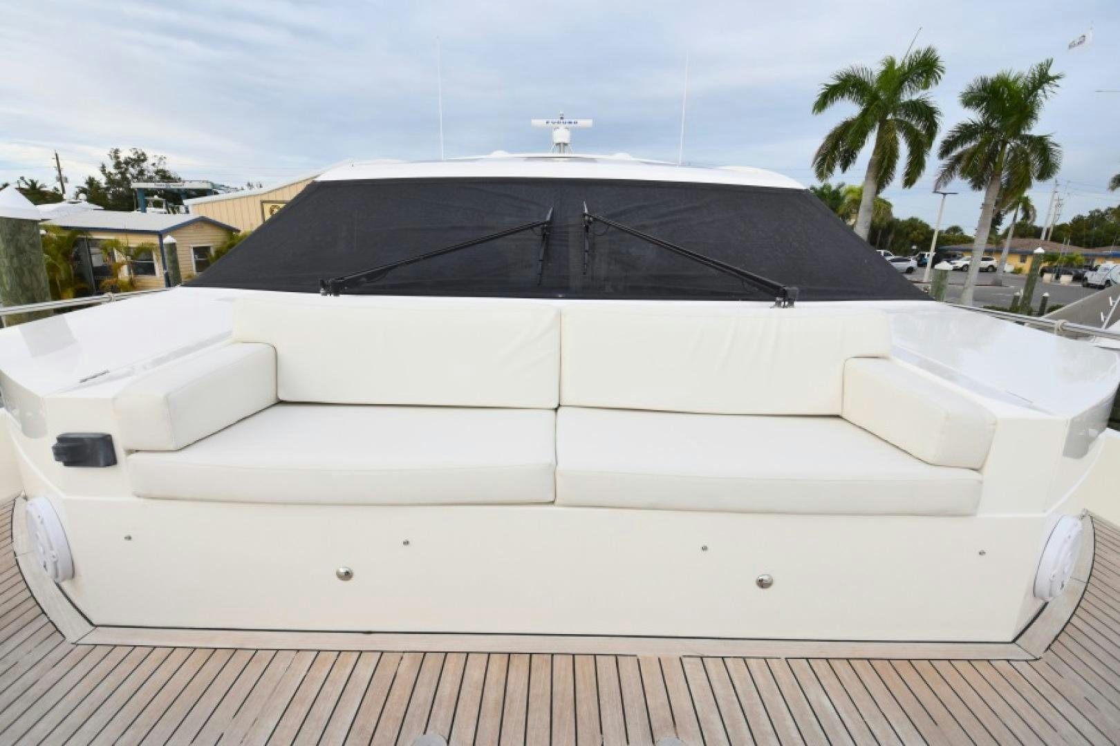a white boat with a black roof aboard No Name Yacht for Sale