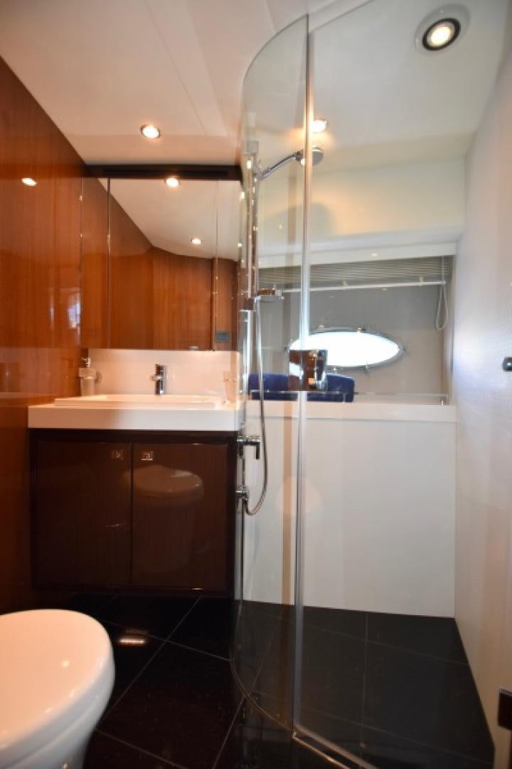 a bathroom with a glass shower aboard No Name Yacht for Sale