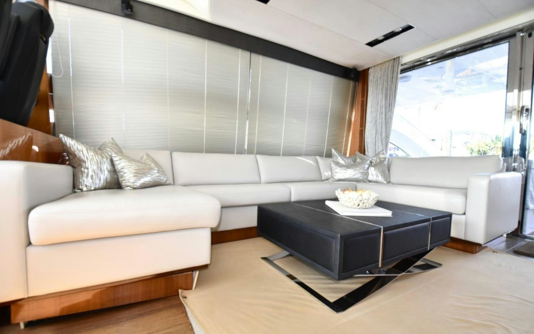 a living room with a coffee table aboard No Name Yacht for Sale