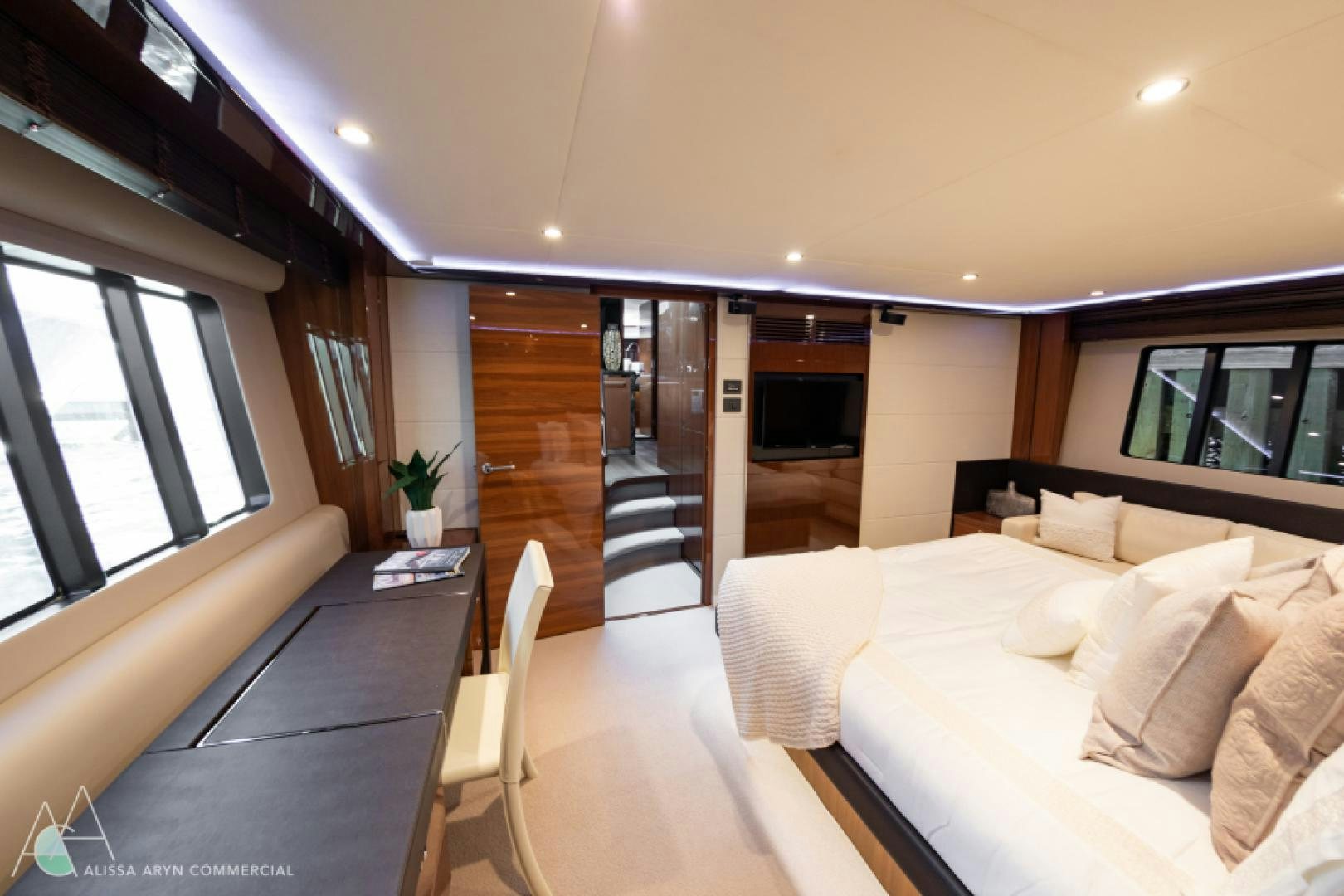 a room with a bed and a table aboard No Name Yacht for Sale