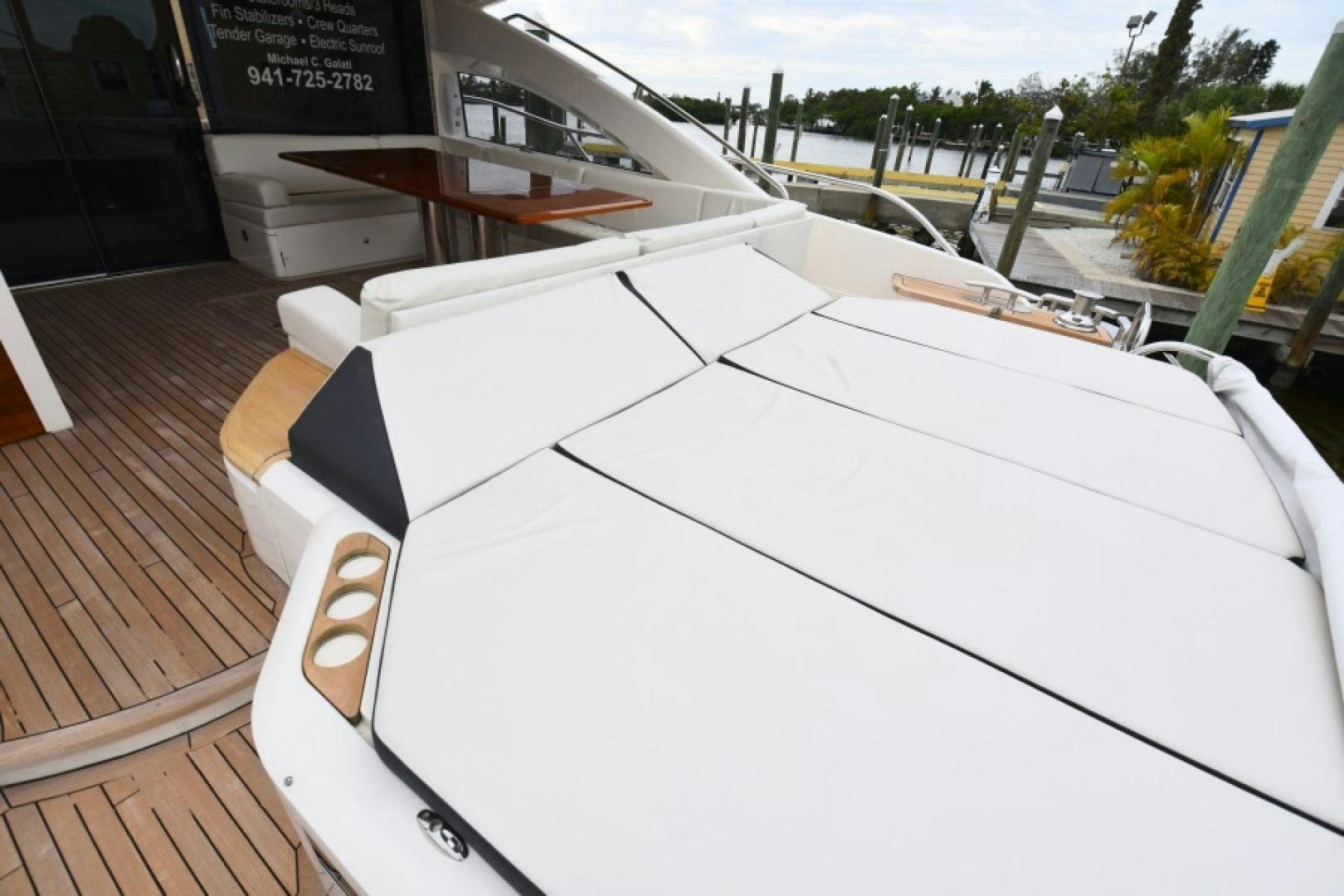 a white rectangular object on a wood surface aboard No Name Yacht for Sale