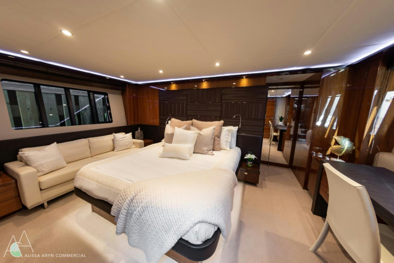 a hotel room with a bed and a couch aboard No Name Yacht for Sale