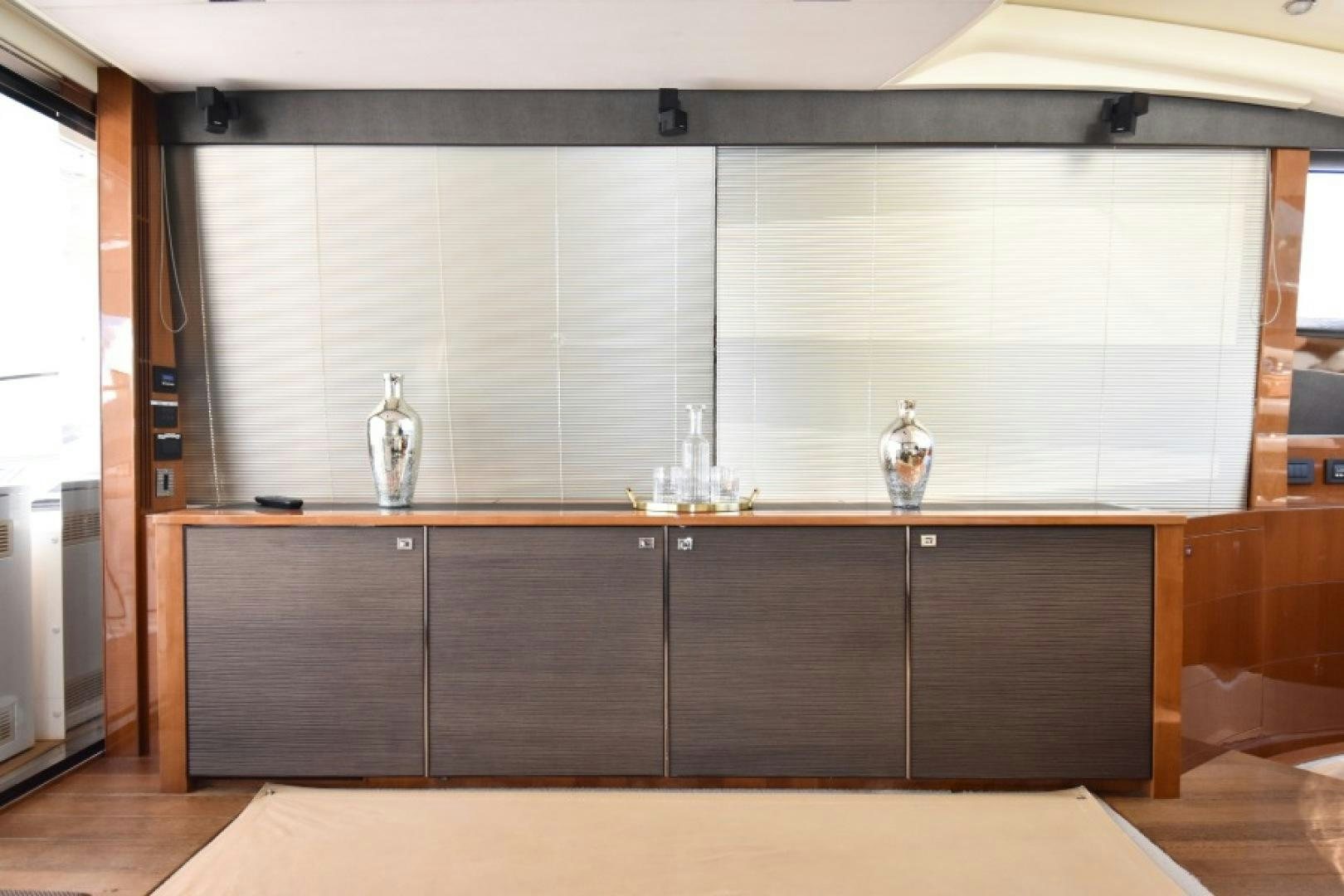 a room with cabinets and a glass vase on the counter aboard No Name Yacht for Sale