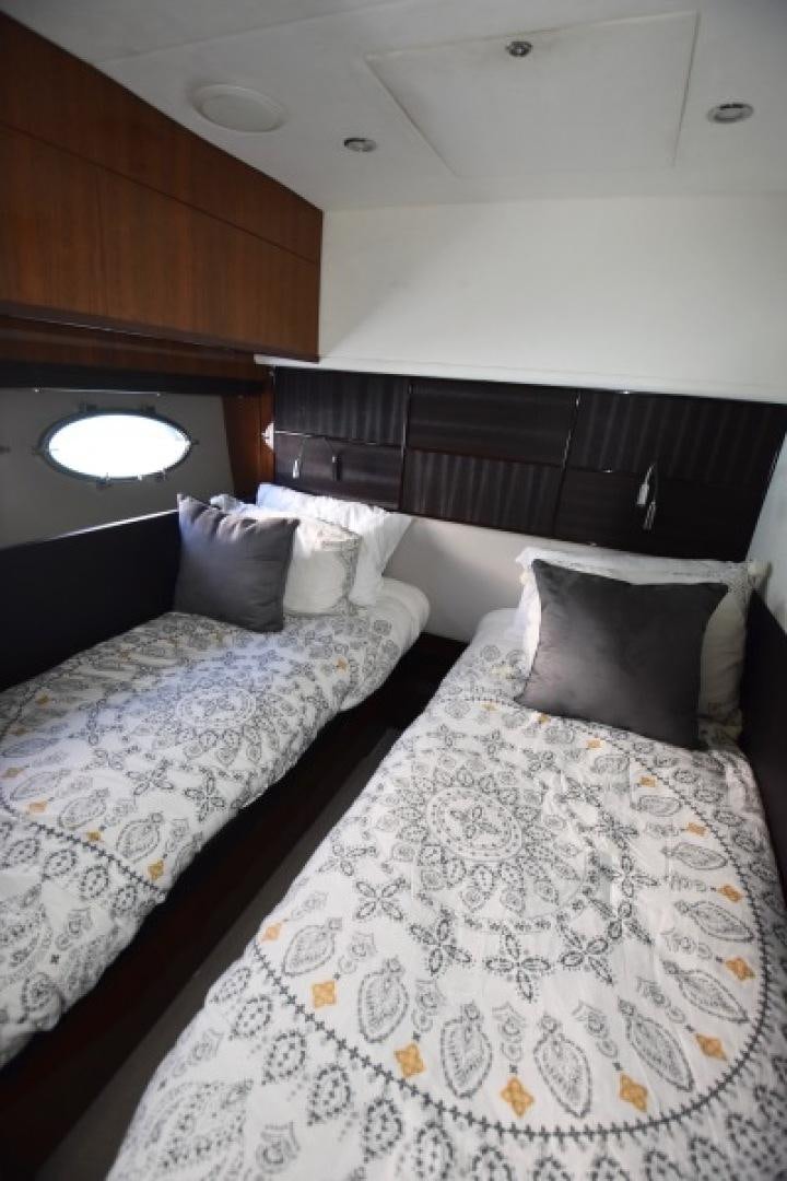a couple of beds in a room aboard No Name Yacht for Sale
