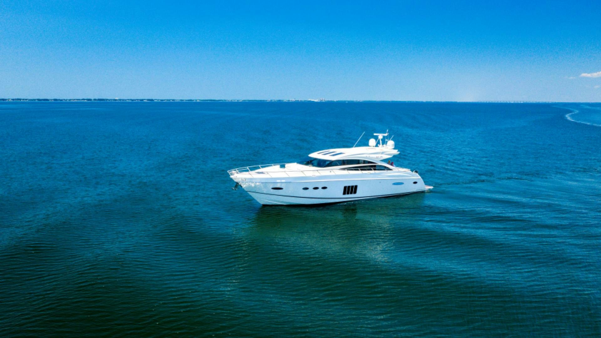 a white yacht in the water aboard No Name Yacht for Sale