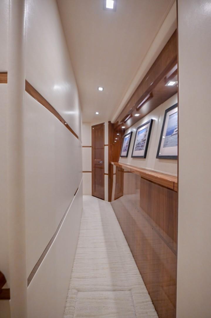 a long hallway with white walls aboard GOOSE Yacht for Sale