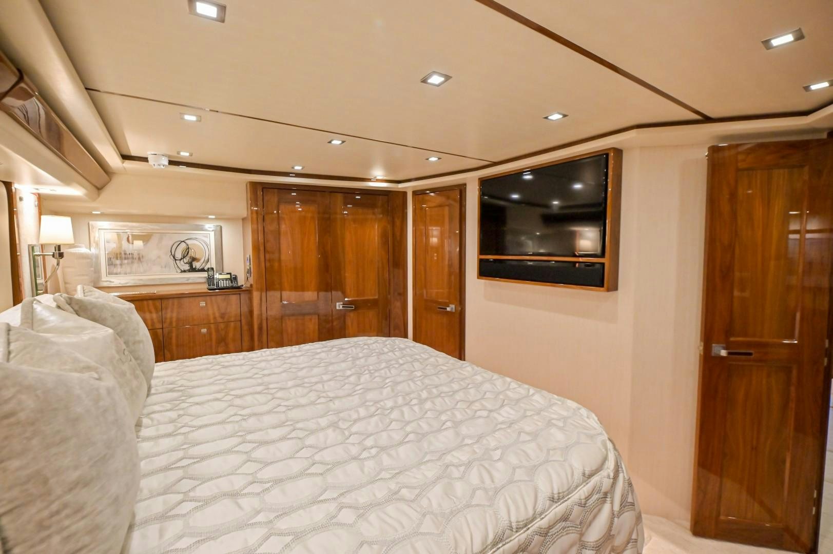 a bedroom with a bed and a television aboard GOOSE Yacht for Sale