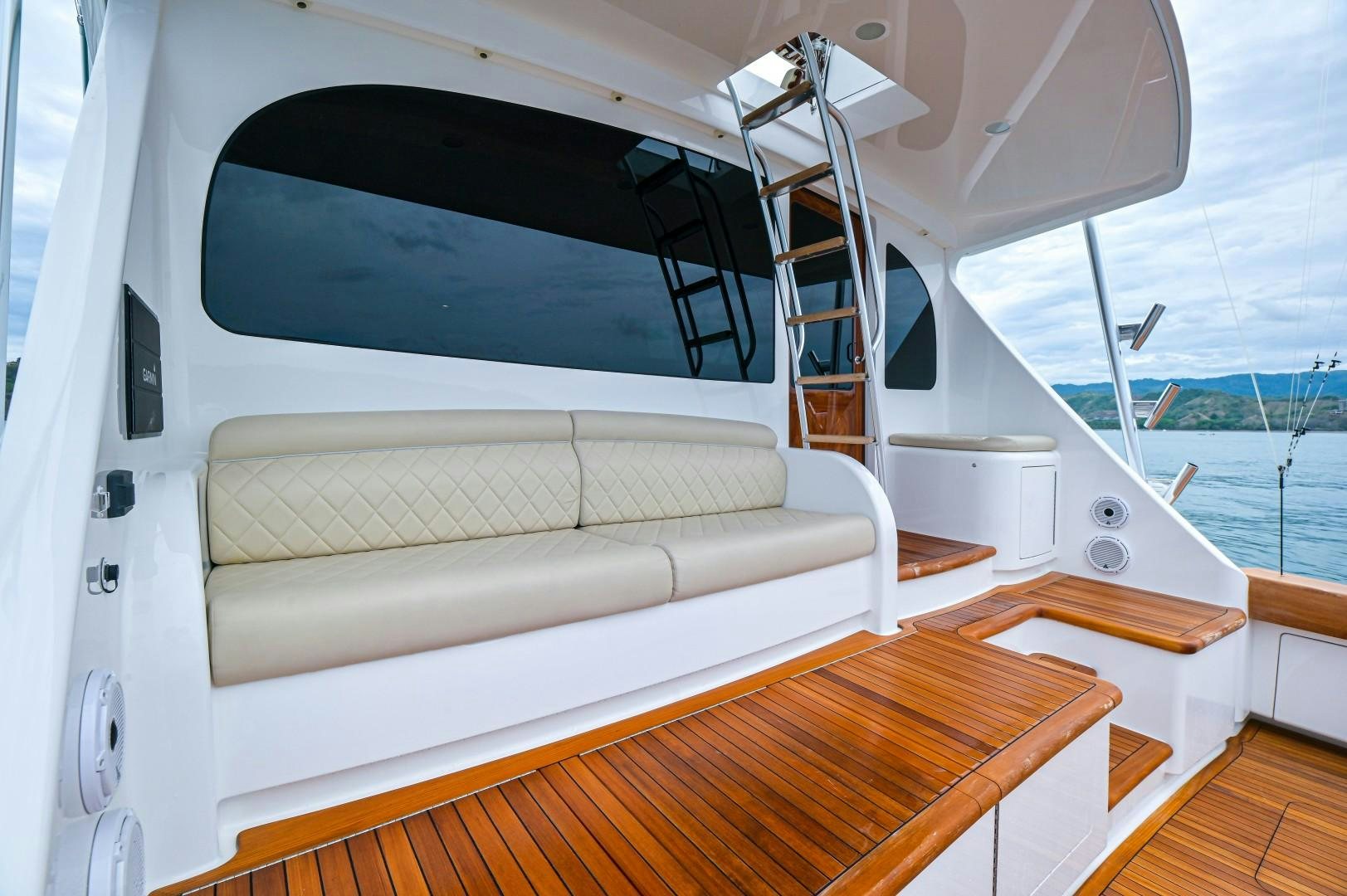 a boat with a white couch aboard GOOSE Yacht for Sale
