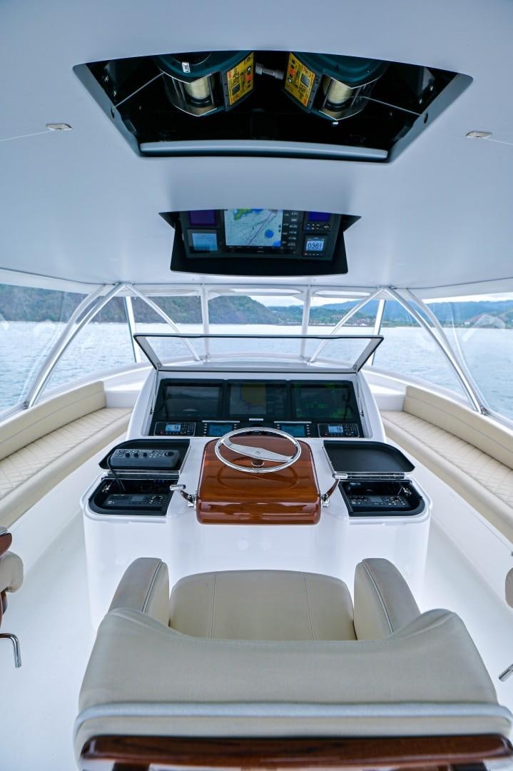 a white table with a couple of electronic devices on it aboard GOOSE Yacht for Sale