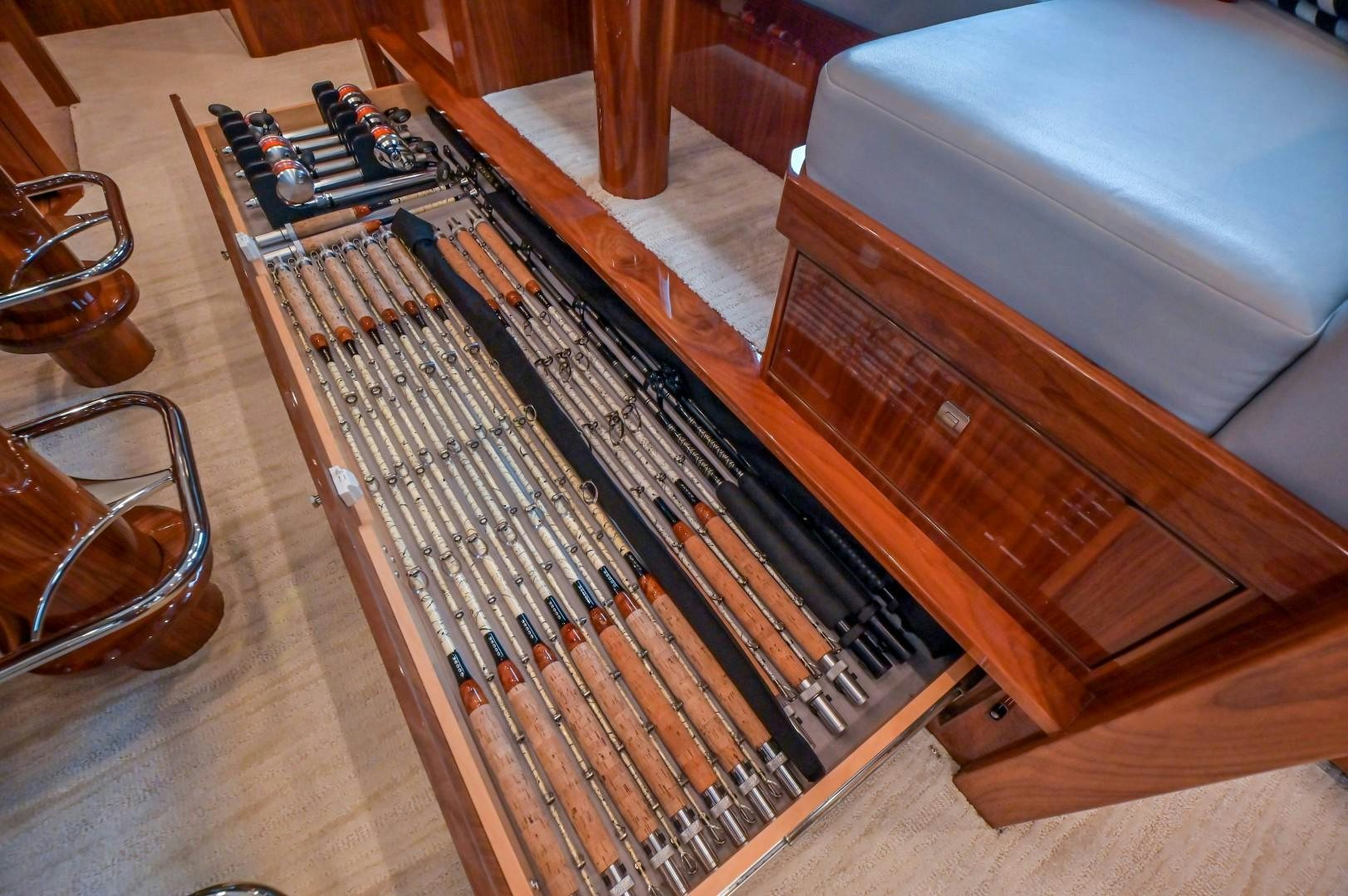 a brown guitar on a wooden floor aboard GOOSE Yacht for Sale